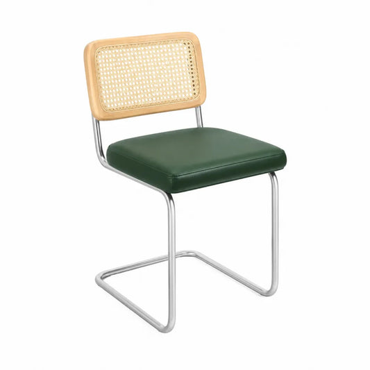 Sedia da pranzo in pelle sintetica verde con schienale in rattan e struttura cromata